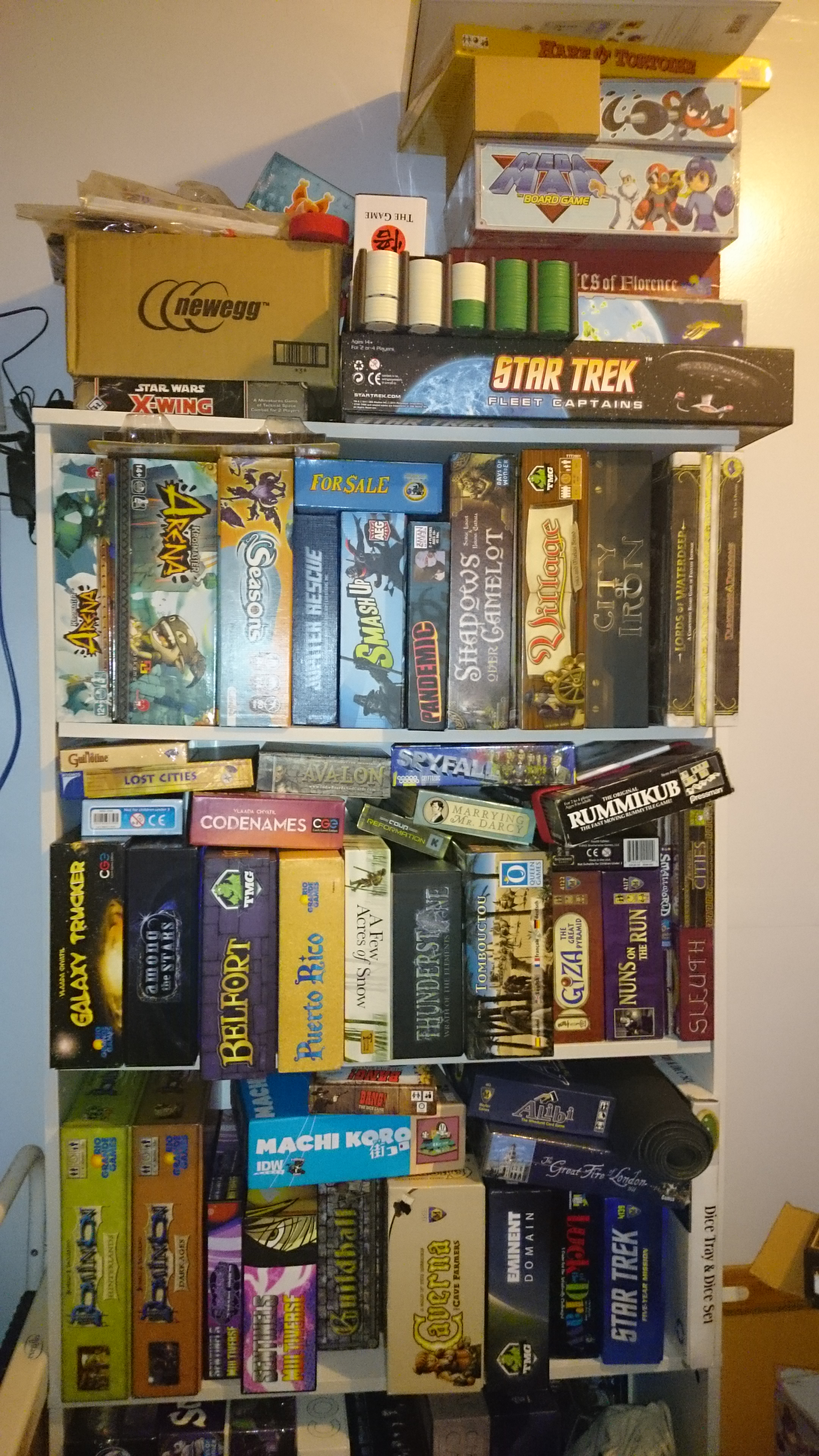 One of my two shelves overflowing with games